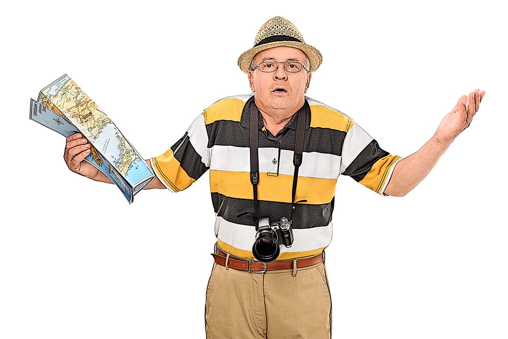 image of older man holding a map, looking lost